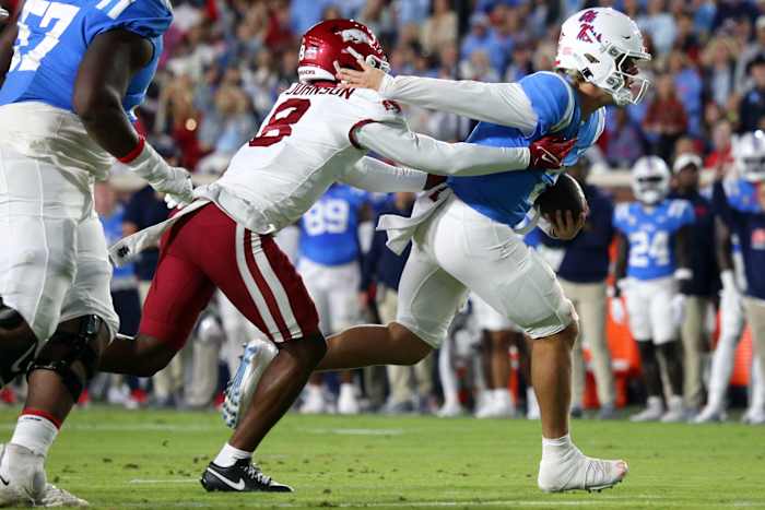 Ole Miss QB Jaxson Dart attempts to escape a sack against the Arkansas Razorbacks on Oct. 7.